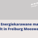 Energiekarawane macht Halt in Freiburg Mooswald mit Logo der Energiekarawane